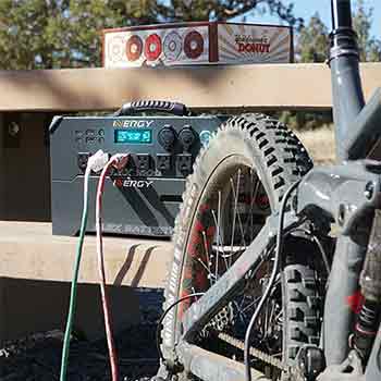 AC outlets on a generator with a bicycle in front