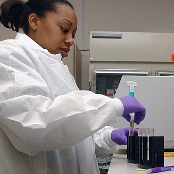 Laboratory technician who is female in a white lab coat