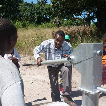 Water engineer who is male with a water pump